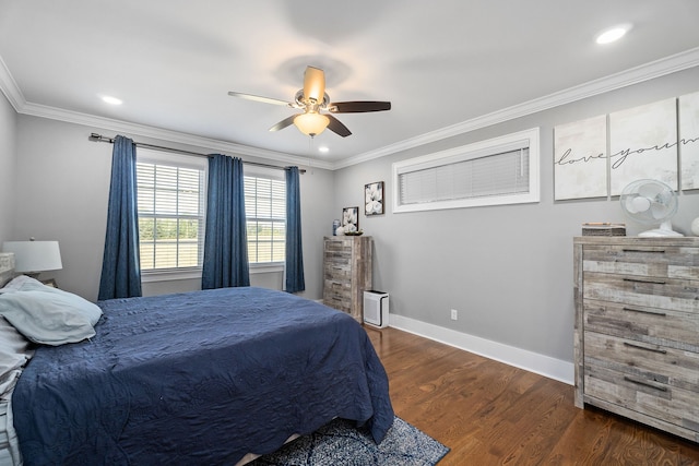 bedroom featuring dark wood-type flooring, ceiling fan, and ornamental molding