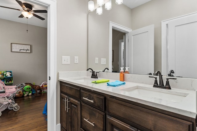 bathroom with vanity, ceiling fan, and wood-type flooring