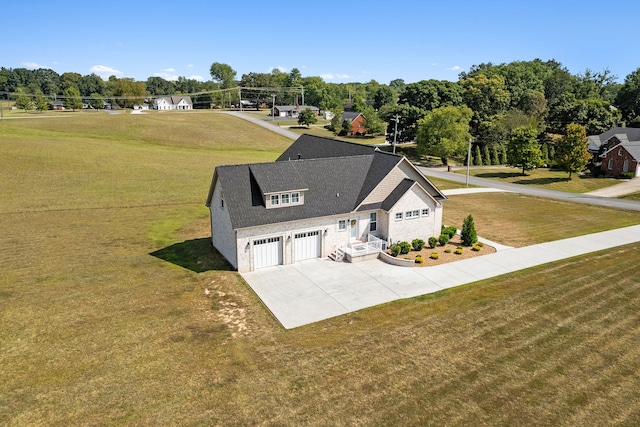 view of front facade with a garage and a front lawn