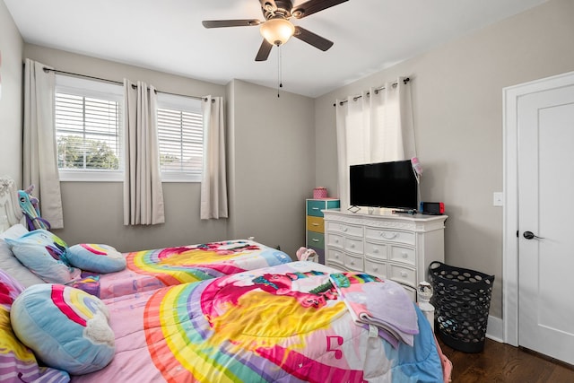 bedroom featuring ceiling fan and dark hardwood / wood-style floors