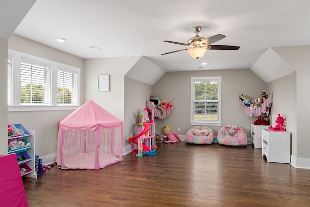 recreation room with lofted ceiling, ceiling fan, and dark hardwood / wood-style flooring