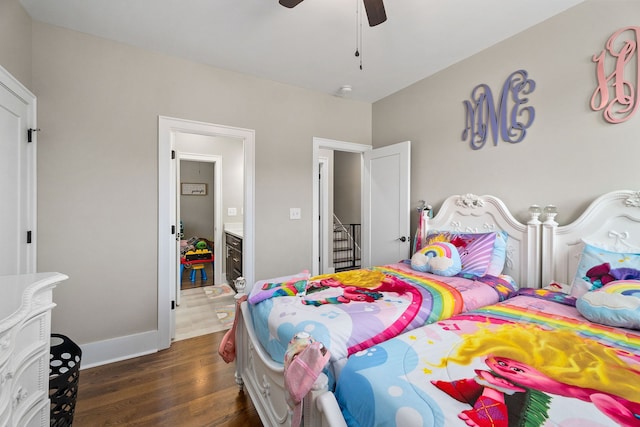 bedroom with dark hardwood / wood-style flooring and ceiling fan