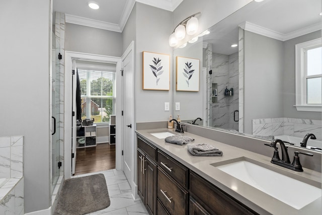 bathroom with plus walk in shower, ornamental molding, and vanity