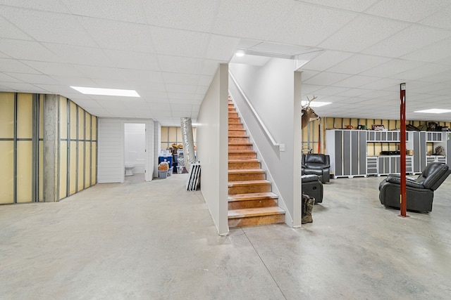 basement with a paneled ceiling