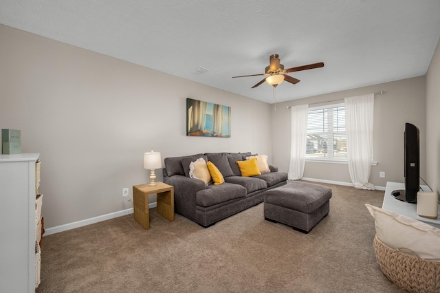 carpeted living room with ceiling fan