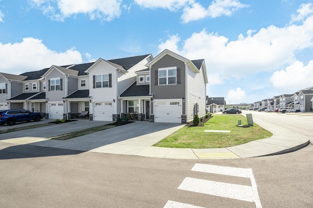 multi unit property featuring a garage and a front yard