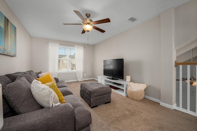 carpeted living room featuring ceiling fan