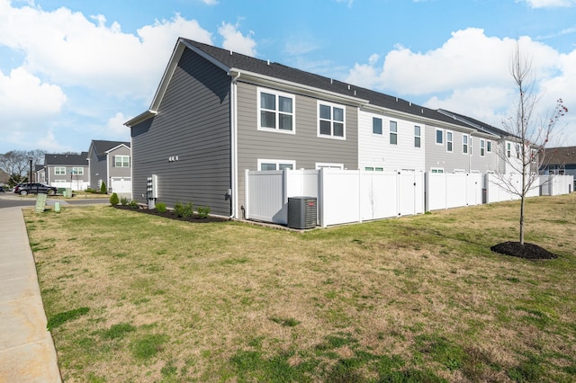 view of side of property with a yard