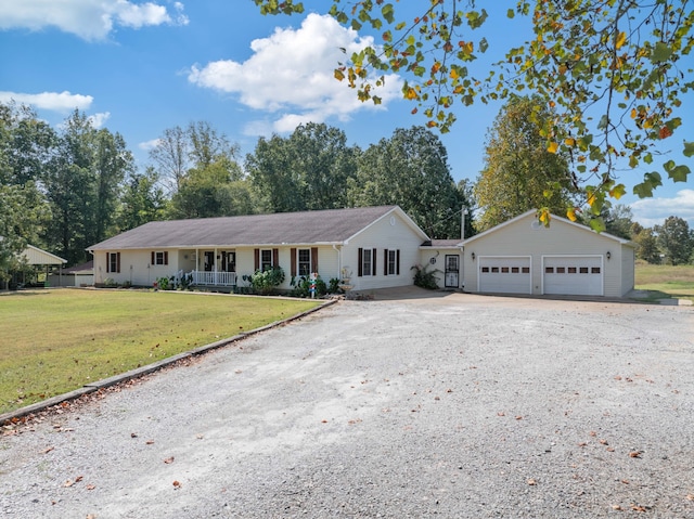 ranch-style home featuring a porch, a garage, and a front yard