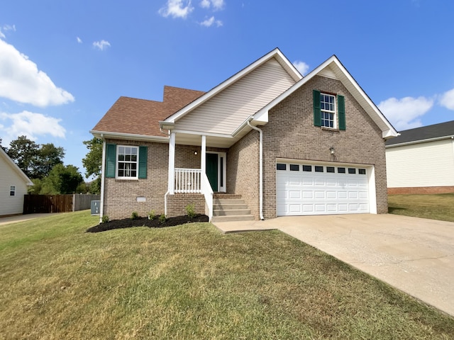 view of front of home with a garage, a front yard, and a porch