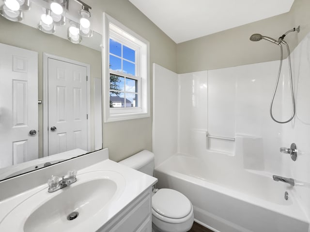 full bathroom featuring toilet, tub / shower combination, and vanity