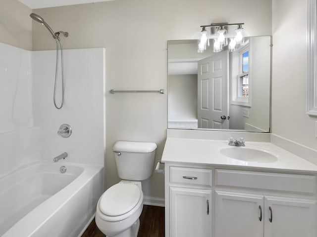 full bathroom featuring vanity, toilet, hardwood / wood-style flooring, and bathing tub / shower combination