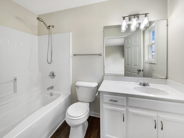 full bathroom featuring vanity, toilet, hardwood / wood-style floors, and shower / tub combination