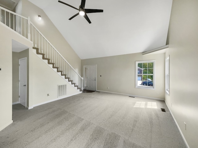 unfurnished living room featuring carpet flooring, ceiling fan, and high vaulted ceiling