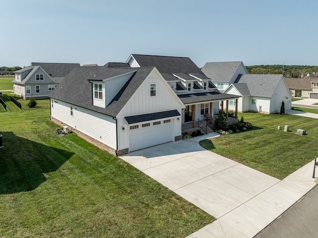 view of front of home featuring a front yard and a garage