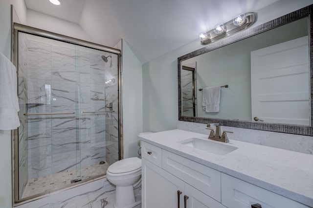 bathroom featuring vanity, toilet, and an enclosed shower