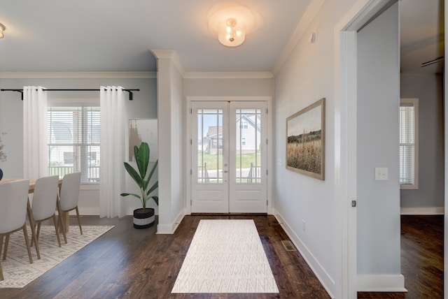 entryway with french doors, dark hardwood / wood-style floors, and crown molding