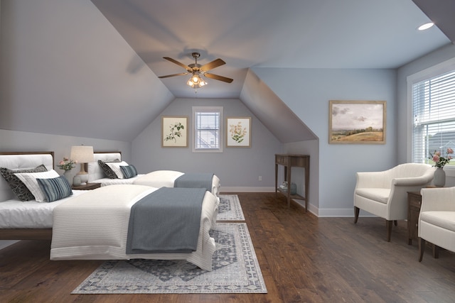 bedroom featuring lofted ceiling, dark wood-type flooring, multiple windows, and ceiling fan