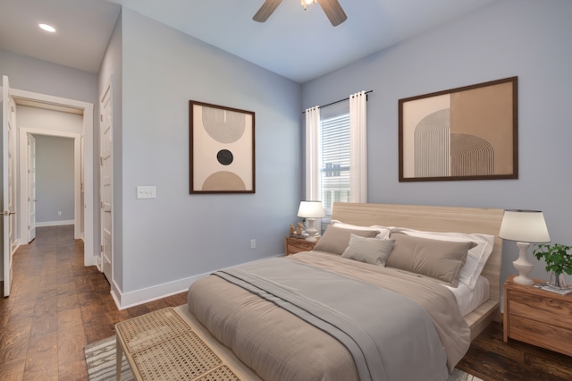 bedroom featuring ceiling fan and dark hardwood / wood-style flooring