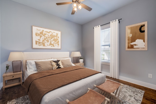 bedroom with ceiling fan and dark wood-type flooring