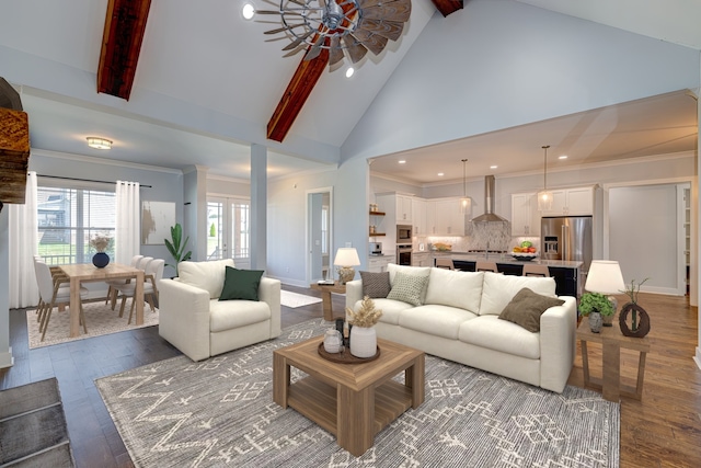 living room featuring beamed ceiling, hardwood / wood-style flooring, high vaulted ceiling, ornamental molding, and ceiling fan