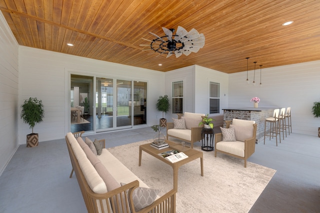 view of patio / terrace with ceiling fan, exterior bar, and outdoor lounge area