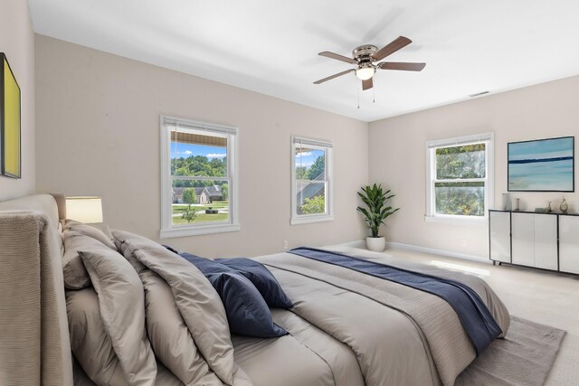 bedroom with ceiling fan and carpet