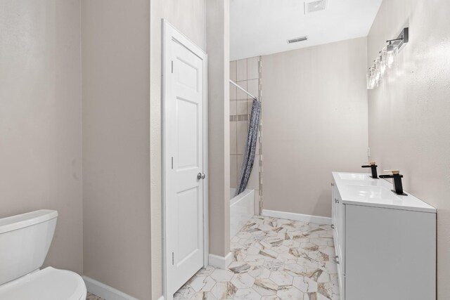 bathroom with vanity, baseboards, shower / bath combination with curtain, toilet, and marble finish floor