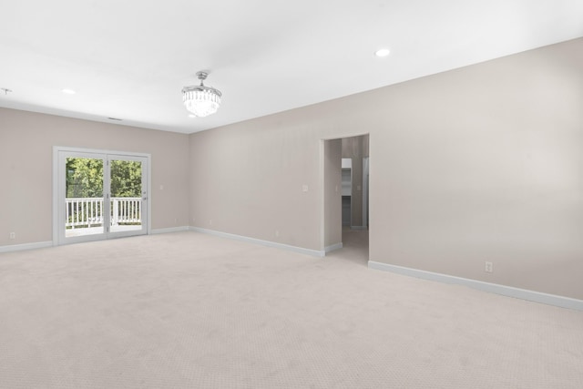 unfurnished room featuring light carpet, recessed lighting, and baseboards