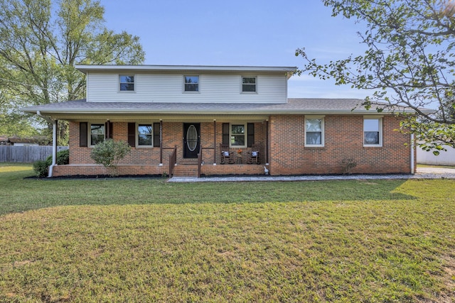 view of front of property with a front lawn and covered porch