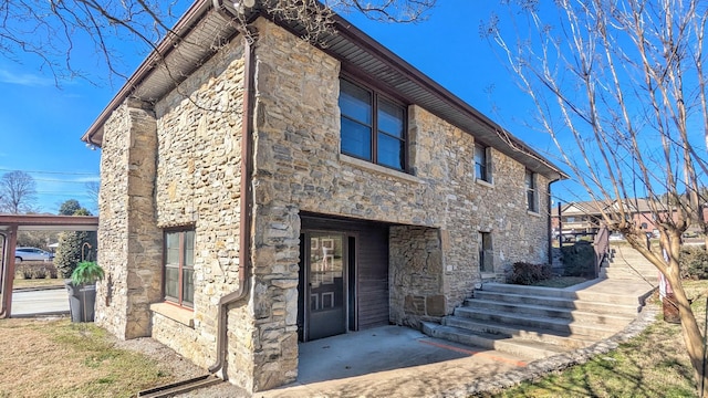 view of front of property featuring stone siding