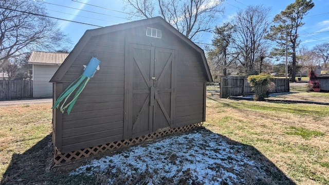 view of shed with fence