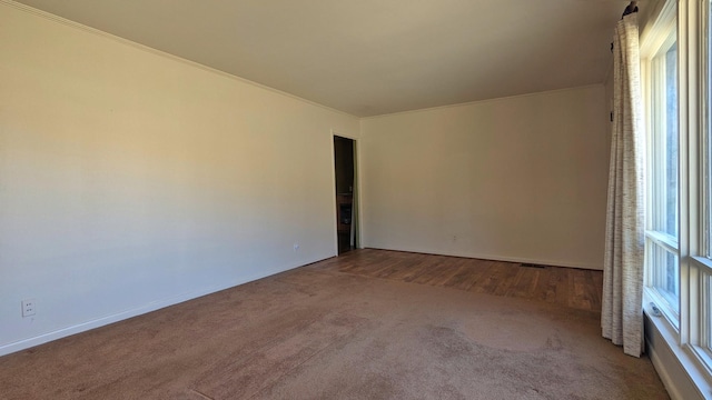 carpeted spare room with visible vents