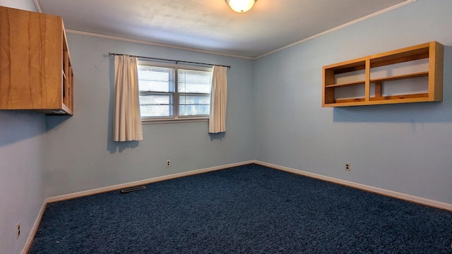 unfurnished room with carpet flooring, crown molding, visible vents, and baseboards