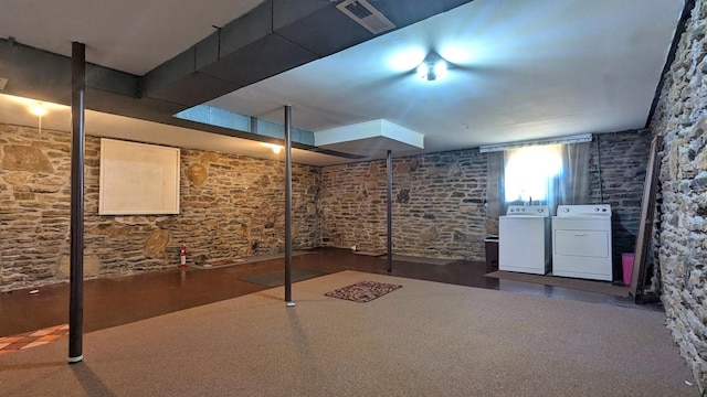 basement with visible vents and independent washer and dryer