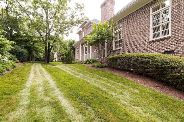 view of yard featuring a sunroom