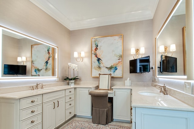 bathroom featuring crown molding and sink