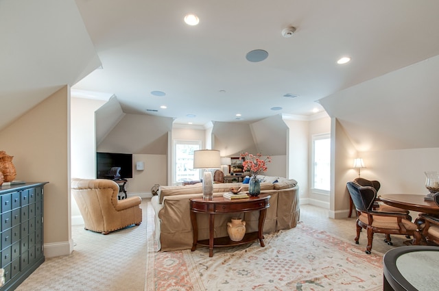 living room featuring light carpet, lofted ceiling, and ornamental molding