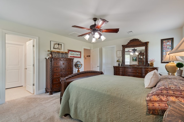 bedroom with light colored carpet and ceiling fan