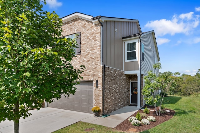 view of front of property with a garage and a front yard