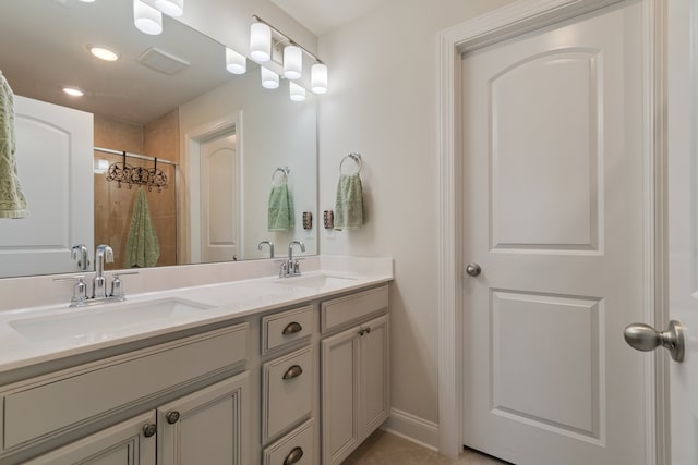 bathroom with tile patterned flooring, vanity, and a shower with curtain