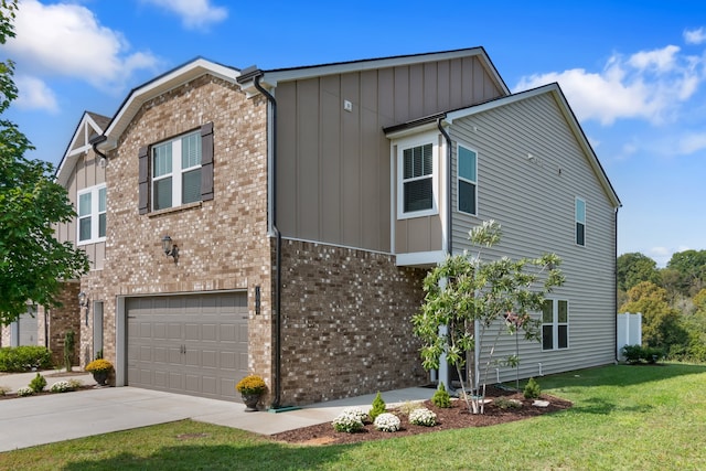 view of front of property with a front lawn and a garage