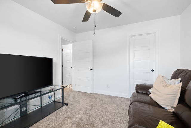 living room with ceiling fan and light carpet