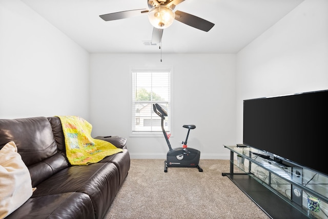 carpeted living room featuring ceiling fan