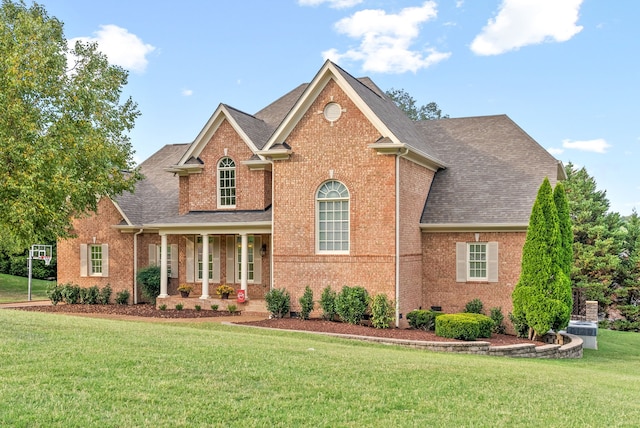 view of front property featuring a front lawn and a porch