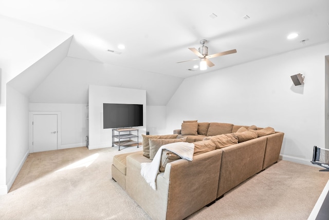 living area with a ceiling fan, visible vents, baseboards, lofted ceiling, and light carpet