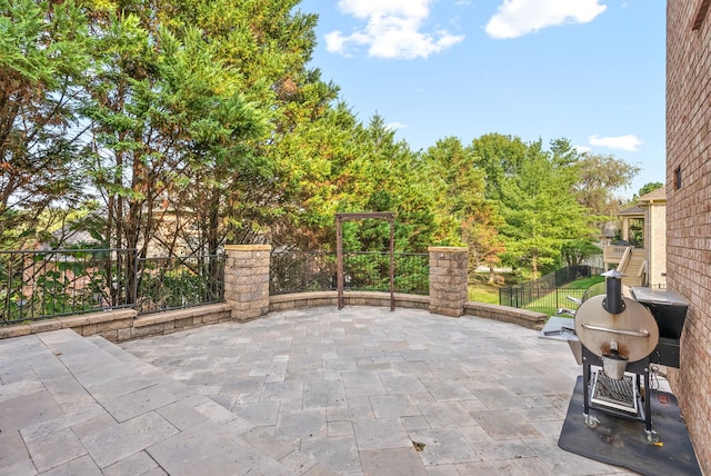 view of patio / terrace with fence