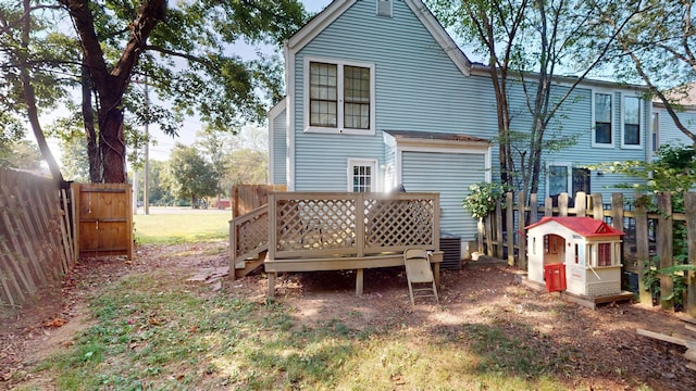 back of property featuring a deck