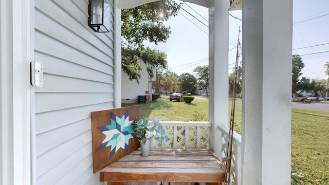 deck featuring a lawn and covered porch