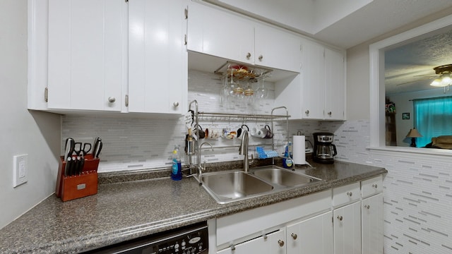 kitchen with white cabinets, ceiling fan, and sink